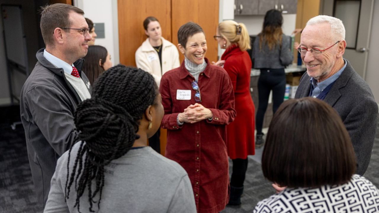 Michael Kotlikoff and Carla Ingrando speak with guests at a ceremony honoring grant awardees.